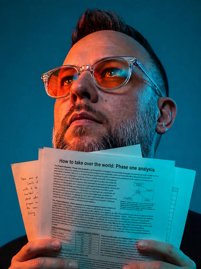 Shaun Scholtz holding a policy document